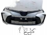COROLLA E21 SEDAN ZDERZAK PRZEDNI PRZÓD DOKŁ. PDC BEZ HALOGENÓW GRILL 070