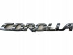COROLLA E21 HATCHBACK NAPIS EMBLEMAT LOGO KLAPY TYLNEJ POKRYWY BAGAŻNIKA