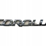 COROLLA E21 HATCHBACK NAPIS EMBLEMAT LOGO KLAPY TYLNEJ POKRYWY BAGAŻNIKA
