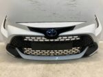 COROLLA E21 LIFT ZDERZAK PRZEDNI PRZÓD GRILL KOMPLETNY 040 BEZ PDC RYSY