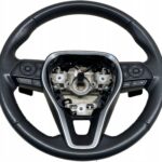 COROLLA E21 KIEROWNICA SKÓRZANA SKÓRA MULTIFUNKCJA PRZYCISKI ŁOPATKI