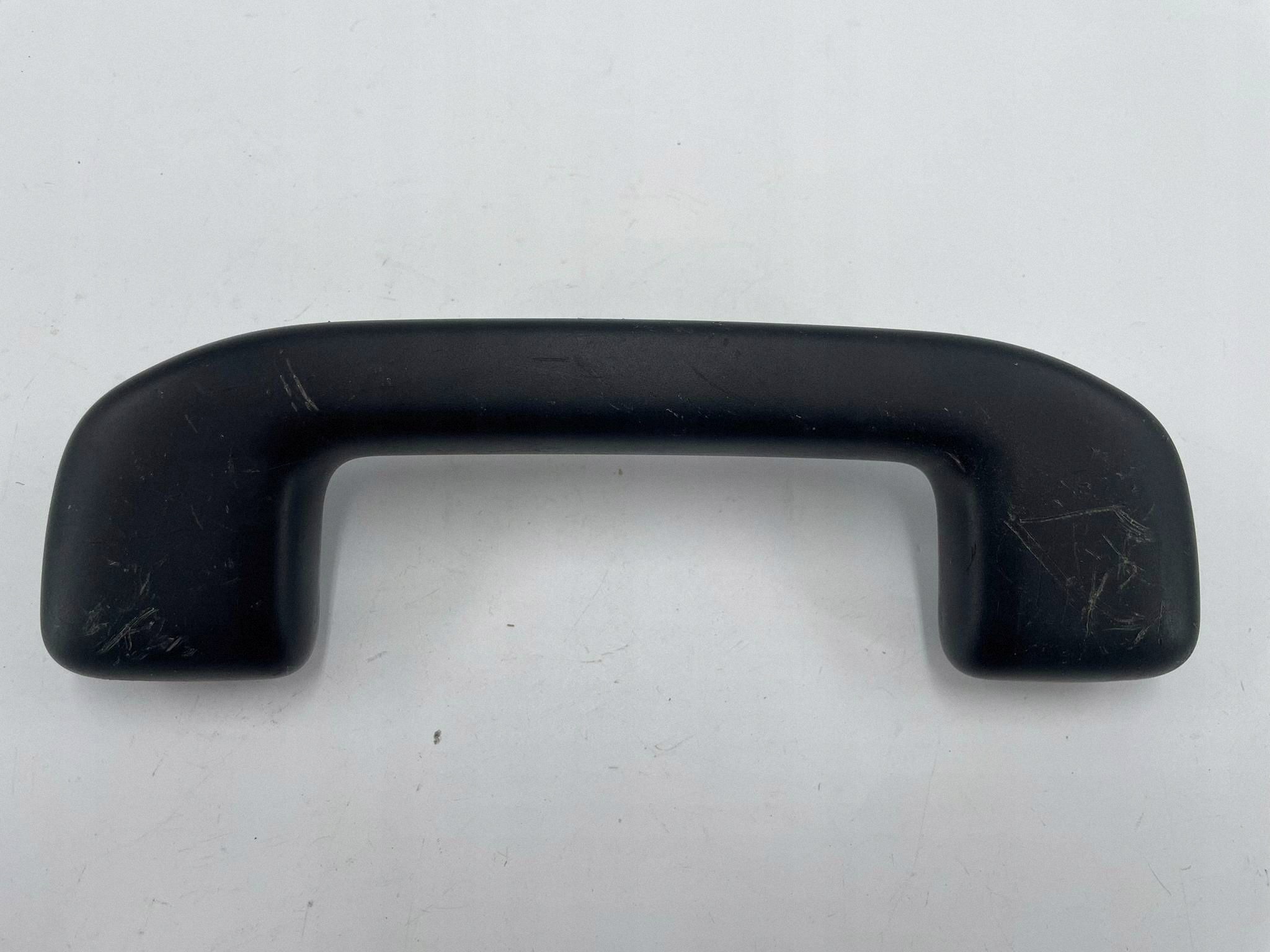 allegro-1c7cf6fda0ec258af6a4494b COROLLA E21 RĄCZKA UCHWYT PODSUFITKI PRZEDNI LEWY PRAWY PRZÓD CZARNA - obrazek 1