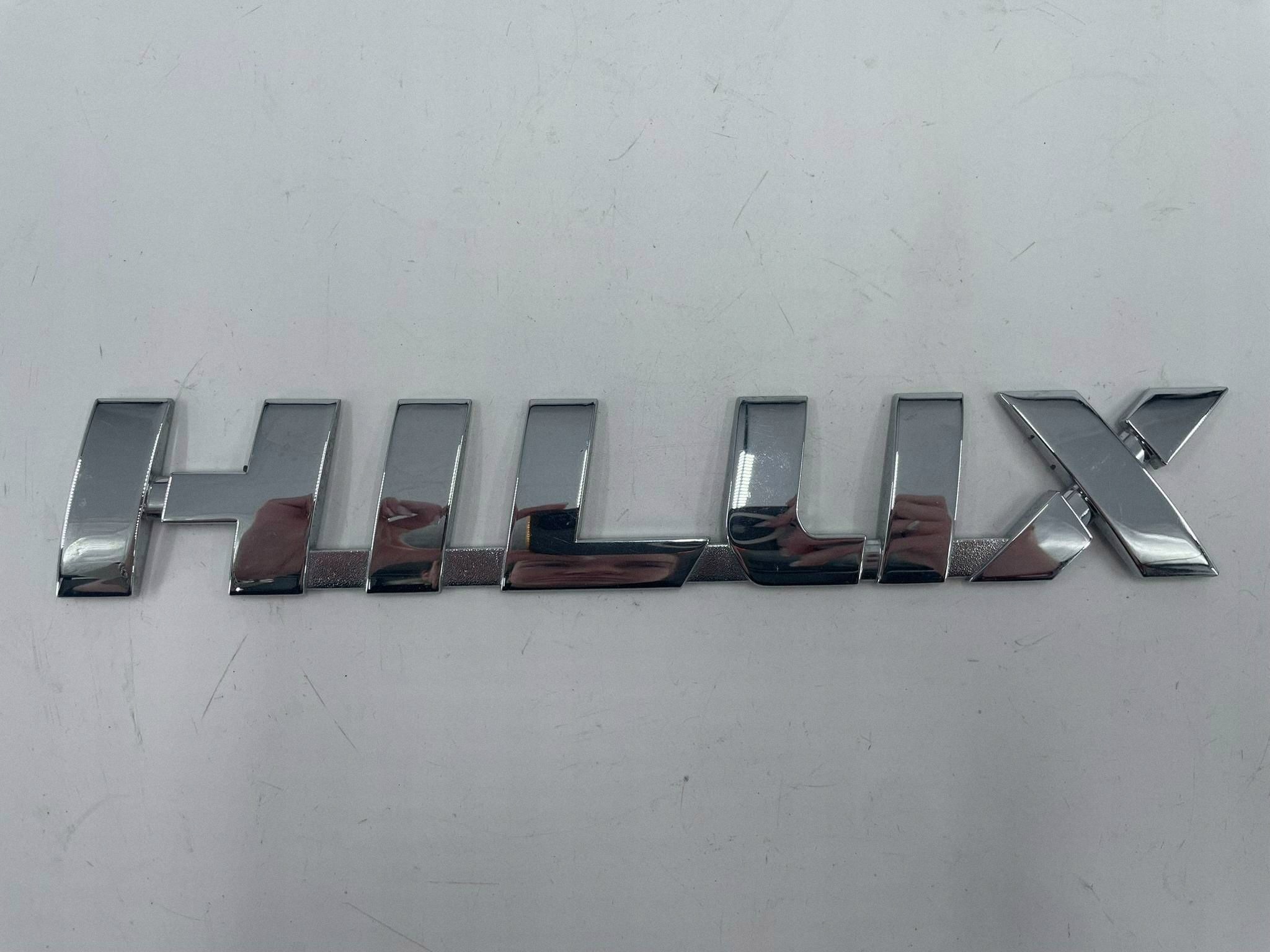 allegro-720d17e78e872a0b10a3e2d8 TOYOTA HILUX NAPIS LOGO EMBLEMAT ZNACZEK - obrazek 1