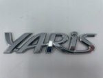 TOYOTA YARIS NAPIS LOGO EMBLEMAT ZNACZEK